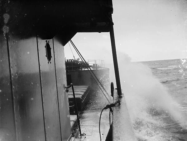 Waves breaking over the bows of the tramp steamer the SS Eston. 1935