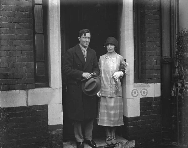 Wedding Mr E W Jacot and Miss Maeve Wolfe leaving Kensington Registry Office after their marriage