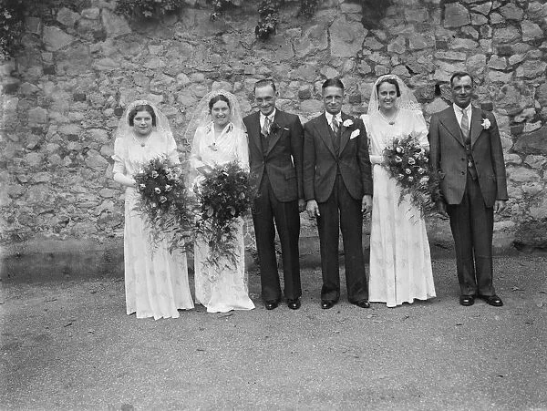 The wedding of Mr W Maitland and Miss R E Clark in Gravesend, Kent. The bridal group