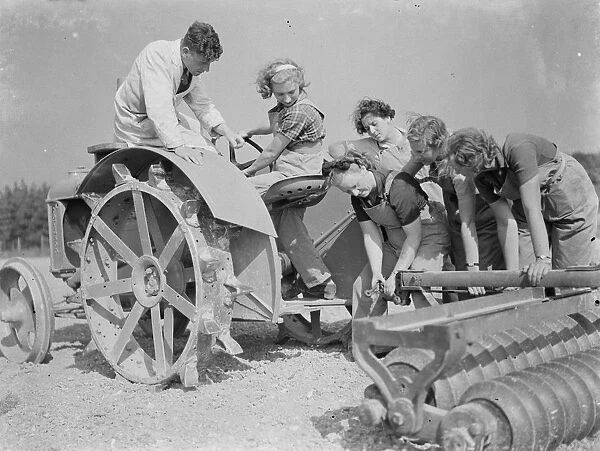Womens Land Army in training on the fields of Wye, Kent. Here Land Girls are