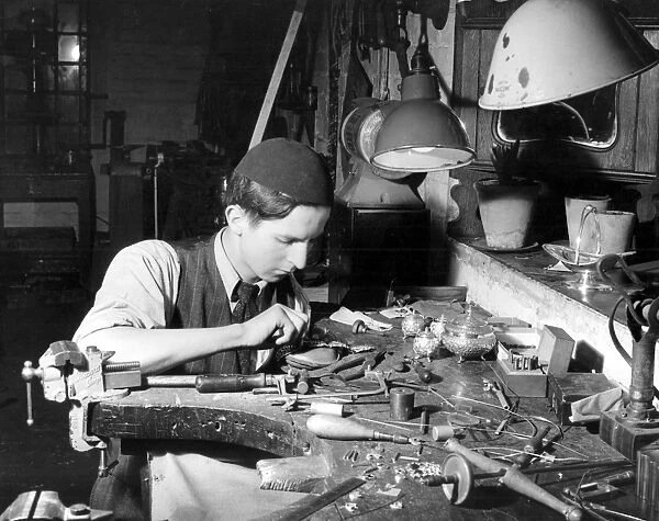 Young craftsman in silver & gold, apprentice Peter Talbot. Kent 1952