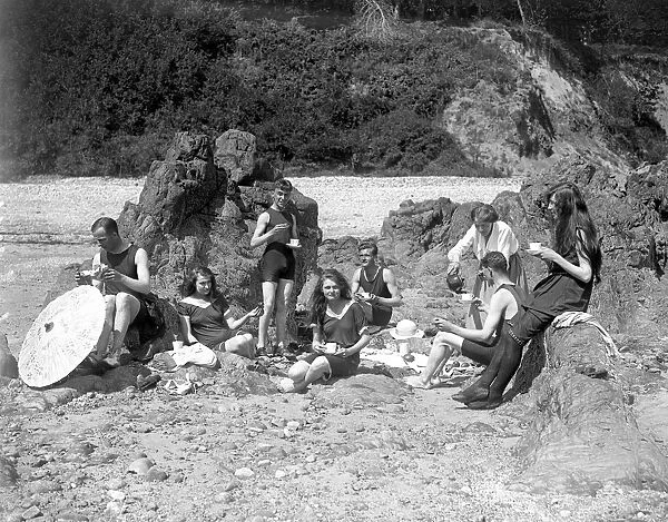 Young people enjoying a beach picnic in Jersey, Channel Isles. 11 September 1919