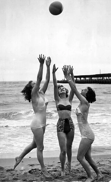 Three young women enjoying the beach at Bournemouth. Left to right Ann Randle