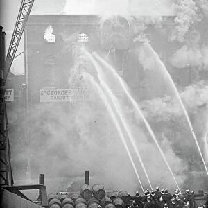 250 firemen fight london rice warehouse blaze. Engines from every one of the 60