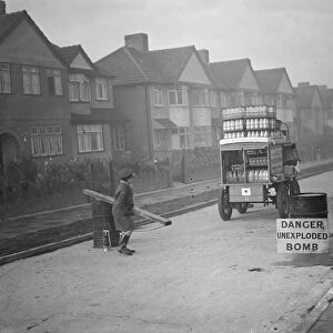 9 November 1940 The milkman is allowed through the barrier to a street in his rounds