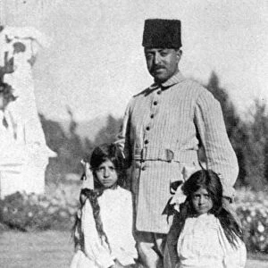 The Amir of Afghanistan photographed with his two daughters. 12 March 1928