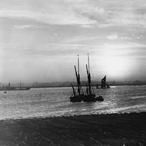 Barges on the River Thames off Long Reach, near Dartford, Kent. January 1938