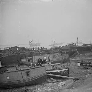Barges on the shoreline at Gravesend Reach. 1938