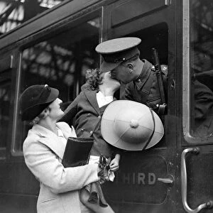 Bidding his daughter and wife goodbye a Royal Engineer ( Postal Section ) off to
