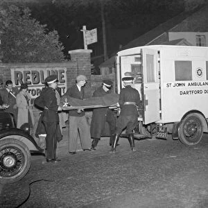 A blackout ambulance receiving a casualty in Dartford, Kent. 1939