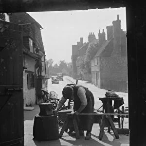 The Blacksmith at work at Westerham Forge, Kent. 1935