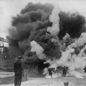A bomb that puts out fires demonstrated at Clapton Stadium. A blazing building