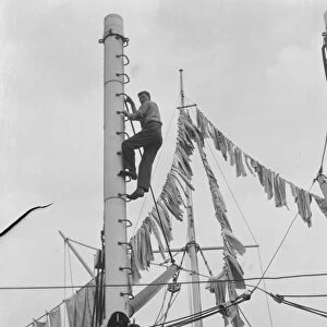 Boys from the Gravesend Sea School, Kent, drying their washing on a flag hoist