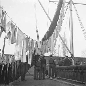 Boys from the Gravesend Sea School, Kent, hanging their washing from the rigging