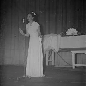 British actress, Jessie Matthews singing on stage at the opening of the Granada
