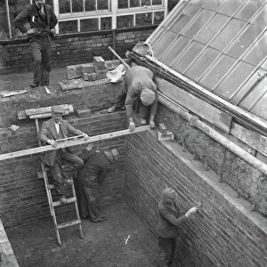 Building the outer foundations for an air raid shelter in a garden in Hextable