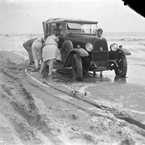 Car stuck on Camber Sands, Sussex. 1933