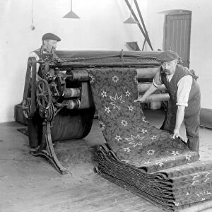 Carpet making at Wilton. Showing hand tufted Axminster Carpet - This machine levels
