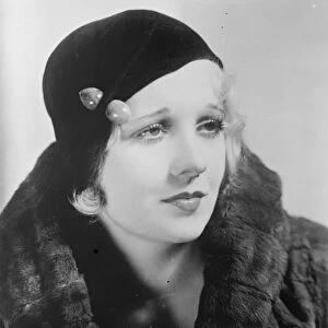 A charming hat thats popular this season. The brimless hat, Miss Anita Page