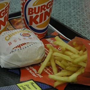 Cheeseburger, chips and soft drinks on a tray at a Burger King restaurant, Canterbury
