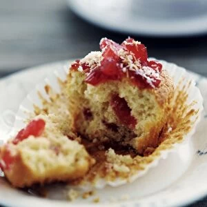 Cherry muffin broken open on white plate credit: Marie-Louise Avery / thePictureKitchen
