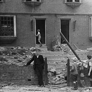 Children inspecting the damage after a bomb fell in Gravesend, Kent during WWII