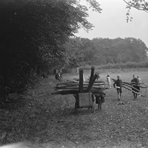 Children use prams to bring firewood from the woods in Sidcup, Kent