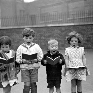 Christmas carols at St Clements Danes School, Drury Lane. 1926