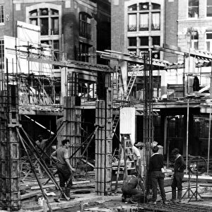 Construction workers working on a building site in central London, England