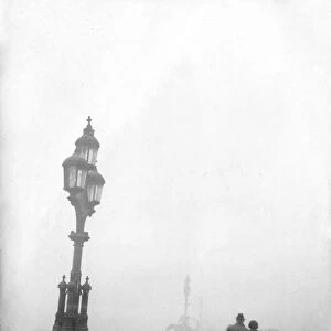 Couple walking across a bridge in London in fog 1950s love couple romance romantic