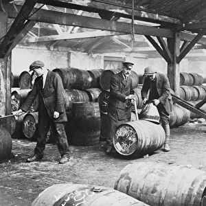 Customs workers at a bonded warehouse in London, England. undated