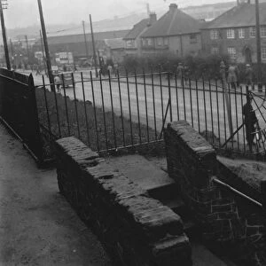 A dangerous footway in Crayford, Kent. 1936