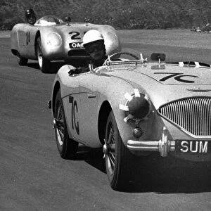 An early Austin Healey 100 at Silverstone in 1955. Behind it is a Buckler DD-1