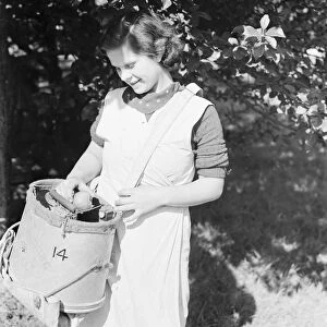 East Malling Research Station open day. Girl with a fruit bucket. 1937