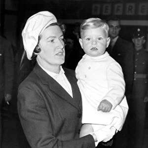 Eighteen-month-old Prince Andrew, in the arms of his nurse Miss Mabel Anderson when