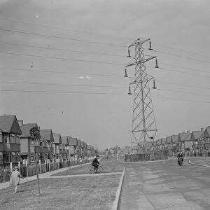 Electricity pylons crossing the road in Sidcup, Kent. 1935