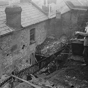 Eight escape when 40 ton wall crashes on two houses at Henley. November 1935