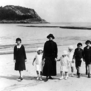 The Ex-Empress of Austria taking her children for a walk on the sands at the Villa Lequeitio
