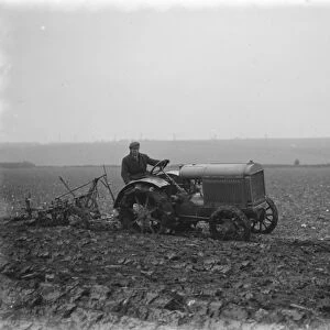 A farmer on a tractor ploughing a field near Swanley, Kent. 1936