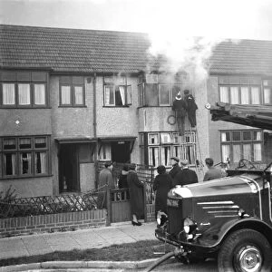 Firemen tend to a fire at Alma house on Old Farm Avenue in Sidcup, Kent