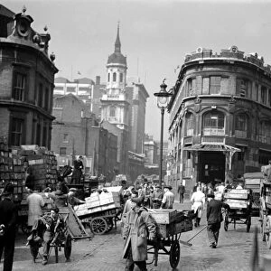 Fish porters, traders and barrow boys in Billingsgate Fish Market, Lower Thames Street