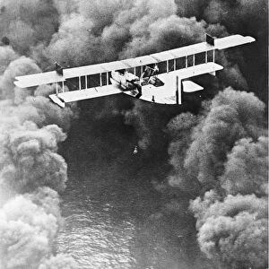 Flying through a smoke screen. The F5L, a seaplane, flying through a smoke screen