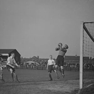 Football match; Erith and Belvedere versus Maidenhead. The goalie makes a save