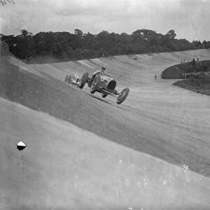 Gold Trophy Race at Brooklands Photo shows : Earl Howe ( Bugatti ) leading Oliver Bertram