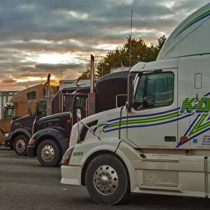 A great selection of trucks parked up at dusk on a Ontario service station SW of