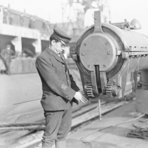 HMS Submarine No 3 One of the crew inspecting the hydraulic water tight cap that