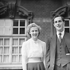The Honourable Daphne Pearson poses with her fiance, Mr John Lakin. 9 August 1939