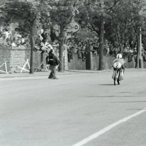 Isle Of Man: German motor cycle racder Ernst Degner riding a 50 c. c. Japanese Suzuki