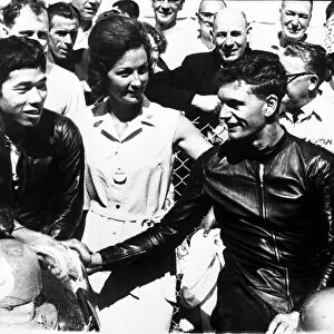 Jim Redman (right), shakes hands with Japans Fumio Ito after winning the 250 cc