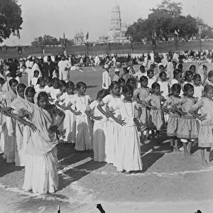 Jubilee celebrations in Baroda state. School girls dancing native dances at the